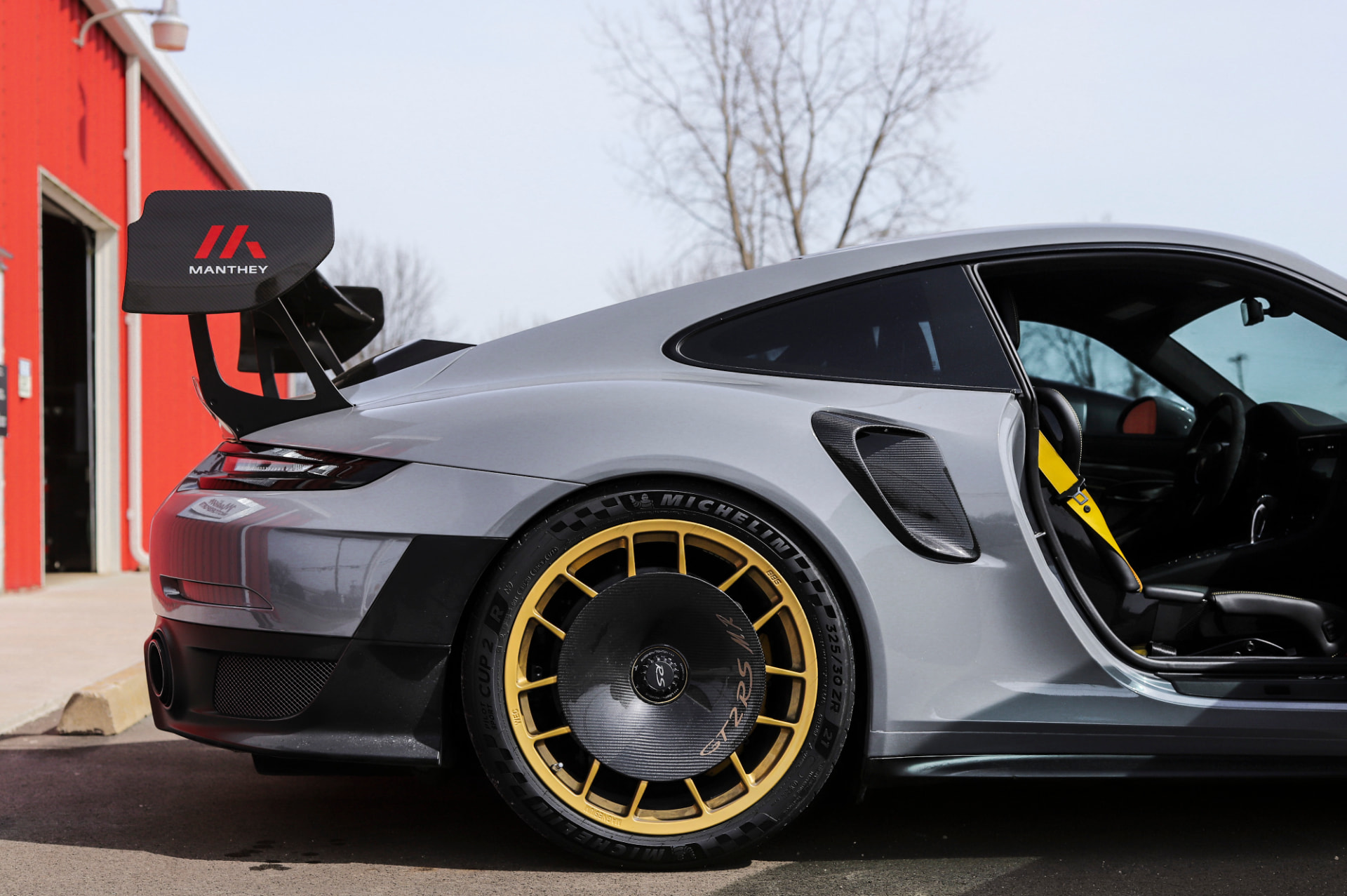 Grey Porsche 911 GT2 RS with Manthey wing at MMr Autosport