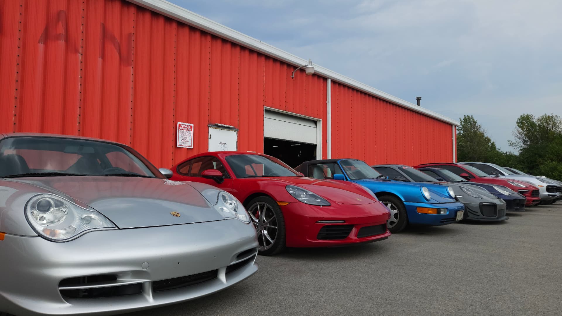 Porsche vehicles lined up outside MMr Autosport